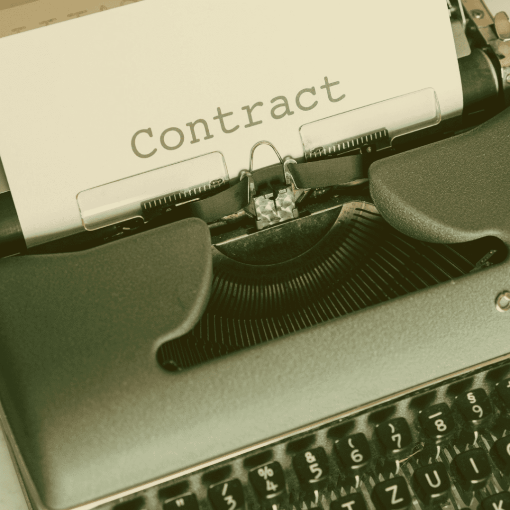 A typewriter with contract writen on the sheet for Terms & Conditions page
